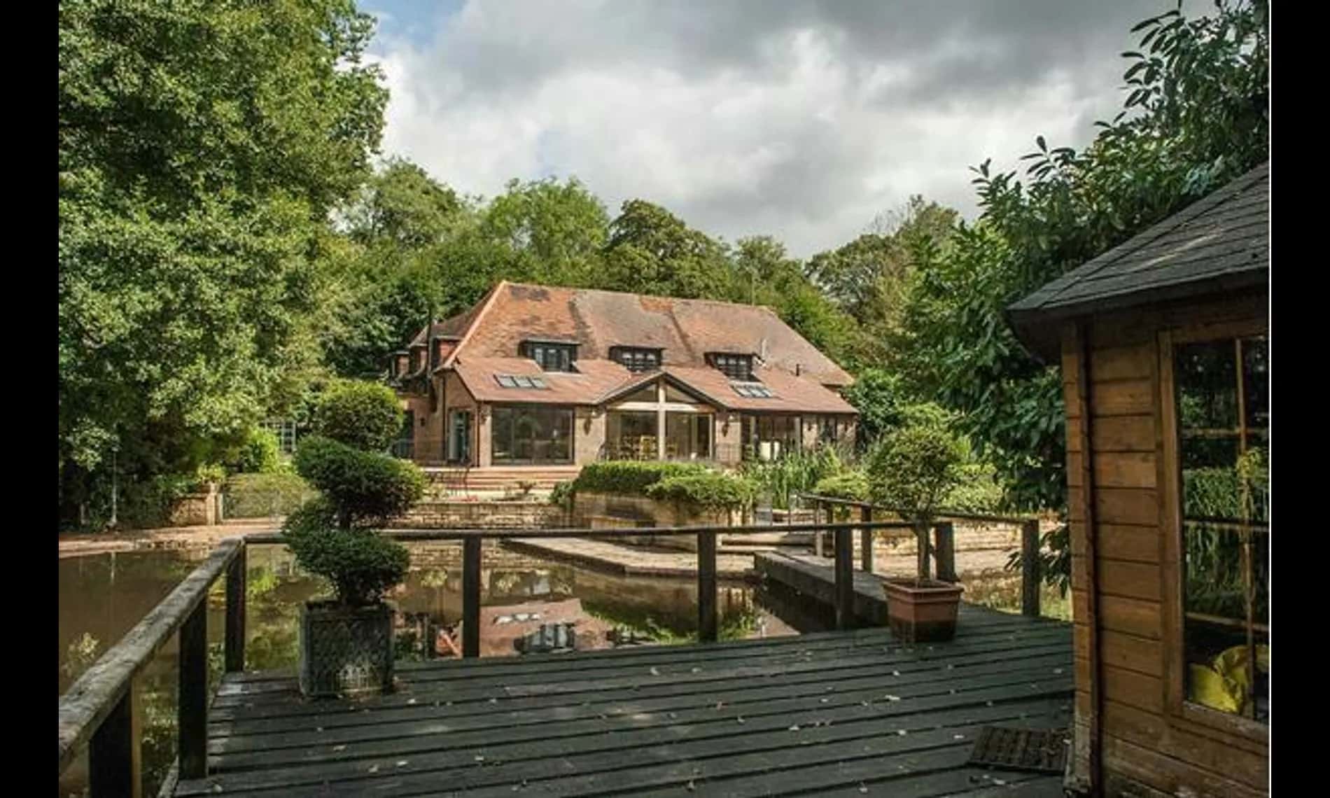 The house at Netley Mill House across the water, decked jetty in the foreground